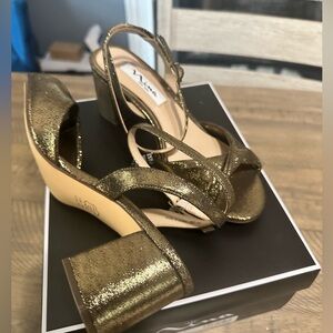 Size 7 women’s gold sling back shoe by Nina Shoes. I have 2 paid never worn